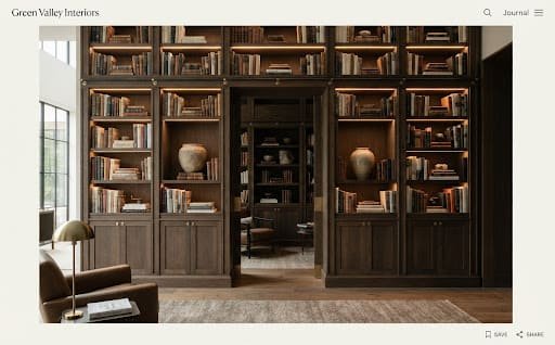 Floor-to-ceiling smoked oak wall library with hidden warm strip lighting