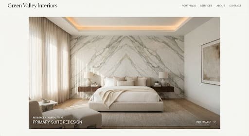 Minimalist primary bedroom suite with a bookmatched marble feature wall and linen bedding